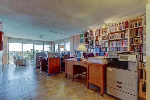 80 Rogers St Unit 2A, Clearwater, FL 33756 - home office featuring a textured ceiling and a ceiling fan