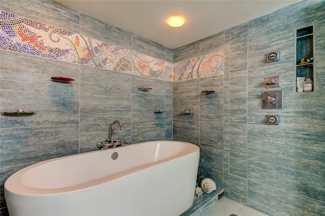 80 Rogers St Unit 2A, Clearwater, FL 33756 - bathroom featuring a soaking tub and tile walls