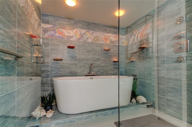 80 Rogers St Unit 2A, Clearwater, FL 33756 - full bath with tile walls, tile patterned flooring, and a freestanding bath