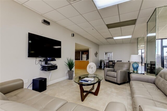 80 Rogers St Unit 2A, Clearwater, FL 33756 - living room with baseboards, visible vents, a paneled ceiling, and light tile patterned floors