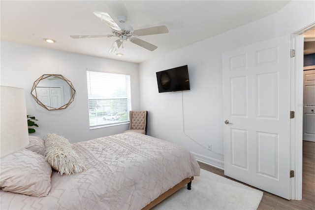 bedroom with baseboards, wood finished floors, ceiling fan, and recessed lighting