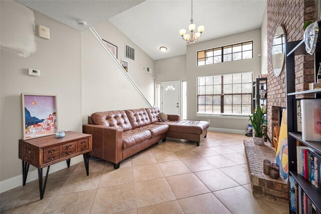8135 Settlers Landing Trl N, Jacksonville, FL 32244 - living area featuring visible vents, an inviting chandelier, light tile patterned floors, and plenty of natural light