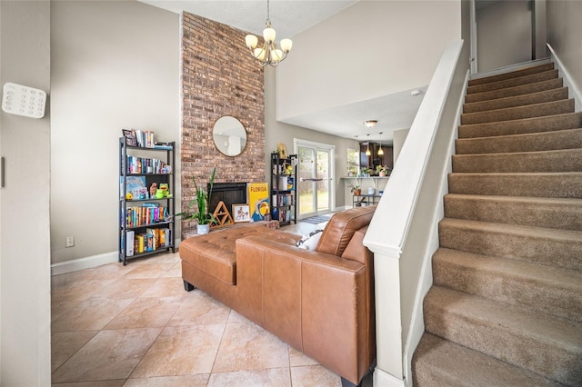 8135 Settlers Landing Trl N, Jacksonville, FL 32244 - living area with stairs, an inviting chandelier, baseboards, a towering ceiling, and a fireplace