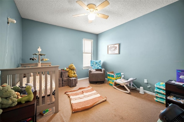 8135 Settlers Landing Trl N, Jacksonville, FL 32244 - carpeted bedroom with a ceiling fan, a nursery area, baseboards, and a textured ceiling