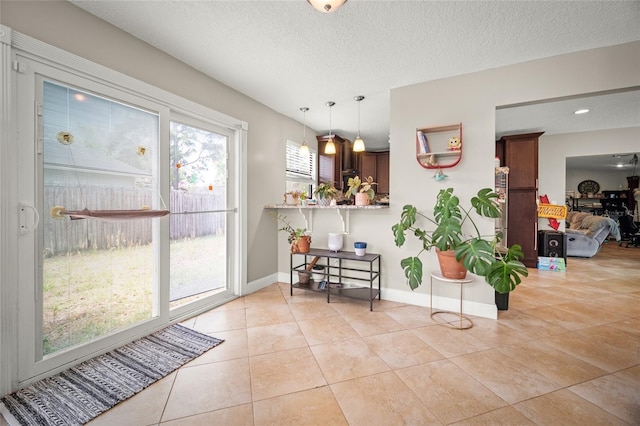 8135 Settlers Landing Trl N, Jacksonville, FL 32244 - interior space with light tile patterned flooring, baseboards, and a textured ceiling