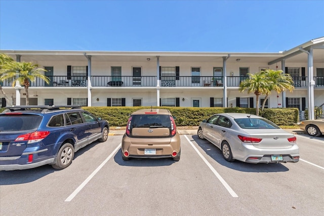 100 Glennes Ln Unit 207, Dunedin, FL 34698 - view of property with uncovered parking