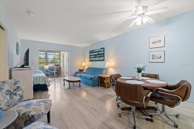 100 Glennes Ln Unit 207, Dunedin, FL 34698 - dining room with wood finished floors and a ceiling fan
