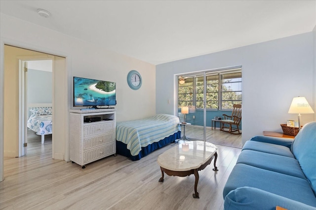 100 Glennes Ln Unit 207, Dunedin, FL 34698 - bedroom featuring light wood-style floors and baseboards