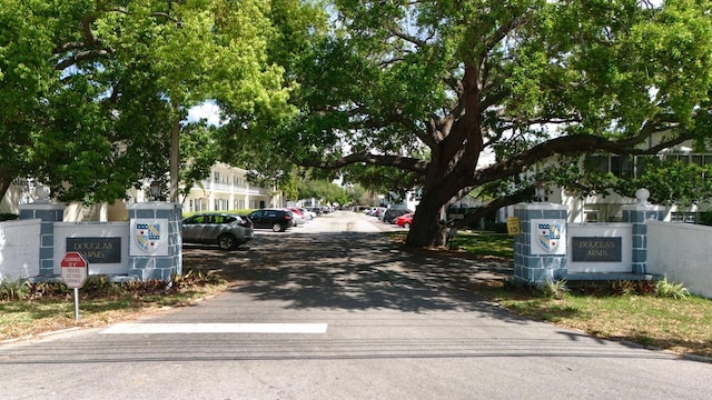 100 Glennes Ln Unit 207, Dunedin, FL 34698 - view of asphalt road featuring traffic signs