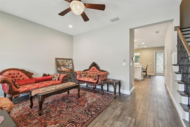 4007 W Gray St, Tampa, FL 33609 - living area featuring stairway, wood finished floors, visible vents, a ceiling fan, and baseboards