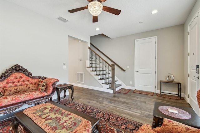 4007 W Gray St, Tampa, FL 33609 - living room featuring stairway, wood finished floors, visible vents, and ceiling fan