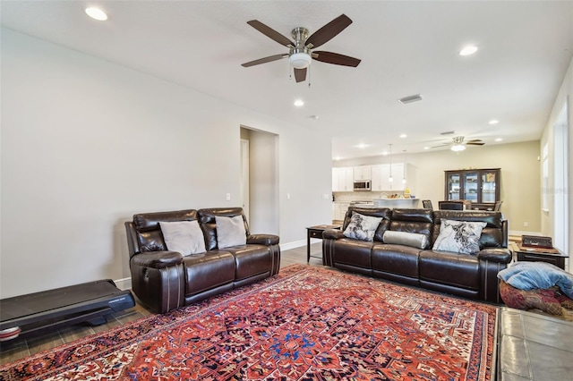 4007 W Gray St, Tampa, FL 33609 - living room with visible vents, a ceiling fan, baseboards, and recessed lighting
