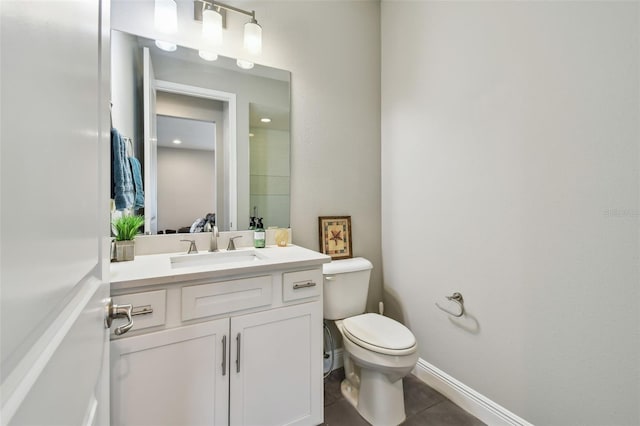 4007 W Gray St, Tampa, FL 33609 - bathroom with baseboards, vanity, tile patterned flooring, and toilet