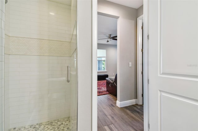 4007 W Gray St, Tampa, FL 33609 - ensuite bathroom with ensuite bathroom, baseboards, wood finished floors, a shower stall, and ceiling fan