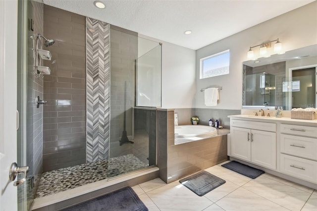 4007 W Gray St, Tampa, FL 33609 - full bathroom featuring a bath, vanity, tile patterned flooring, and a stall shower