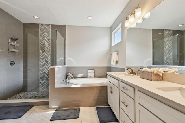 4007 W Gray St, Tampa, FL 33609 - bathroom featuring a bath, a sink, double vanity, a tile shower, and tile patterned flooring