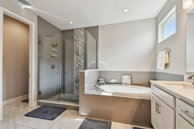 4007 W Gray St, Tampa, FL 33609 - bathroom featuring a bath, visible vents, recessed lighting, a shower stall, and vanity