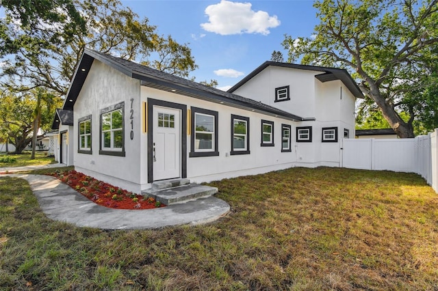 7210 8th Ave N, Saint Petersburg, FL 33710 - view of front facade featuring entry steps and stucco siding