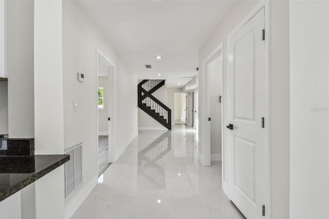7210 8th Ave N, Saint Petersburg, FL 33710 - hall with recessed lighting, stairway, and light marble finish flooring