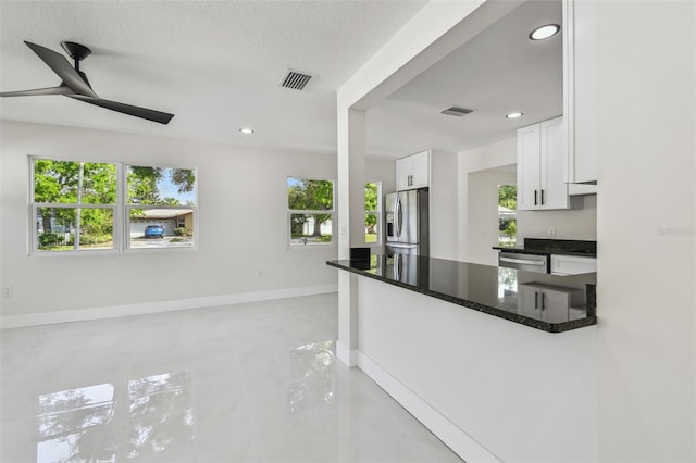 7210 8th Ave N, Saint Petersburg, FL 33710 - kitchen featuring appliances with stainless steel finishes, white cabinets, a ceiling fan, recessed lighting, and a textured ceiling