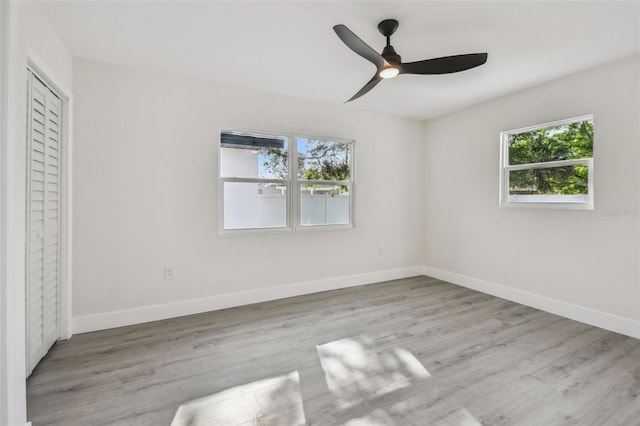 7210 8th Ave N, Saint Petersburg, FL 33710 - unfurnished bedroom featuring wood finished floors and ceiling fan