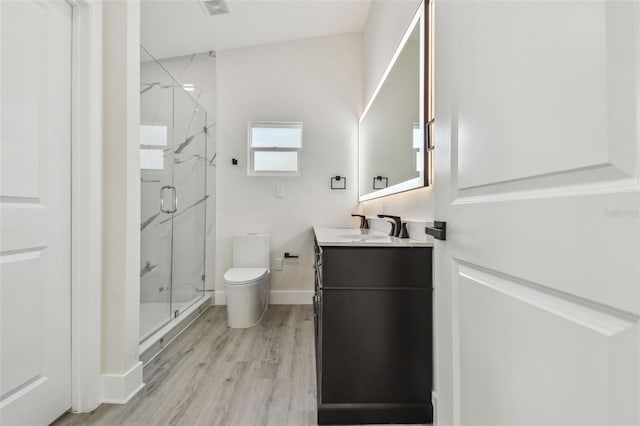 7210 8th Ave N, Saint Petersburg, FL 33710 - full bath with a marble finish shower, vanity, and wood finished floors