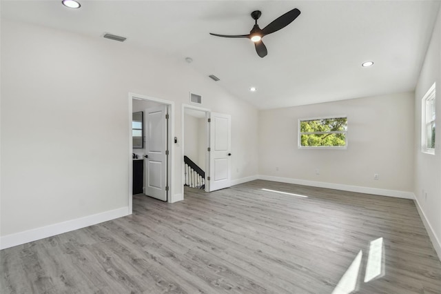 7210 8th Ave N, Saint Petersburg, FL 33710 - spare room with a ceiling fan, wood finished floors, vaulted ceiling, and recessed lighting