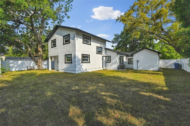 7210 8th Ave N, Saint Petersburg, FL 33710 - back of house with a fenced backyard and stucco siding