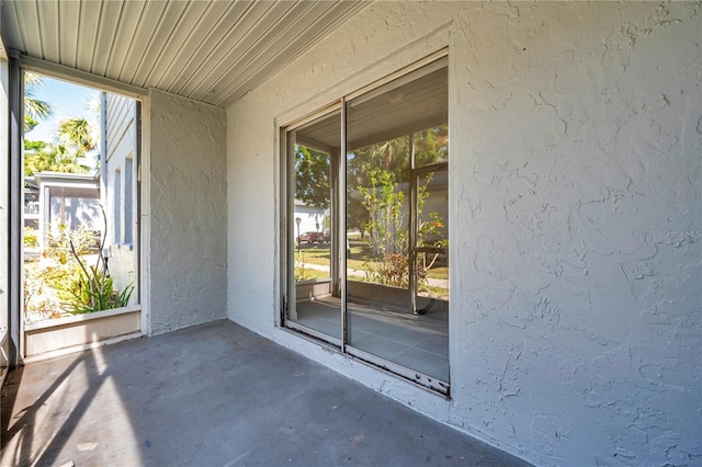 unfurnished sunroom with plenty of natural light