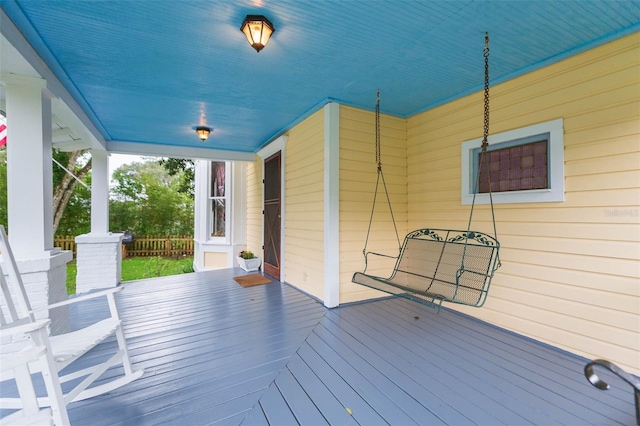 wooden terrace featuring a porch