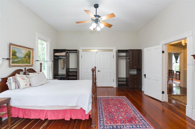 bedroom featuring dark wood-style flooring and ceiling fan