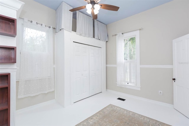 interior space featuring ceiling fan