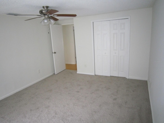 4118 Dellbrook Dr, Tampa, FL 33624 - unfurnished bedroom featuring a closet, carpet floors, ceiling fan, and baseboards
