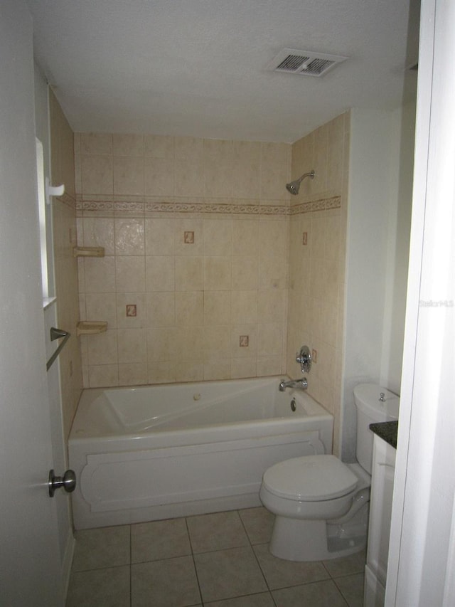 4118 Dellbrook Dr, Tampa, FL 33624 - bathroom featuring tile patterned floors, visible vents, tub / shower combination, and toilet