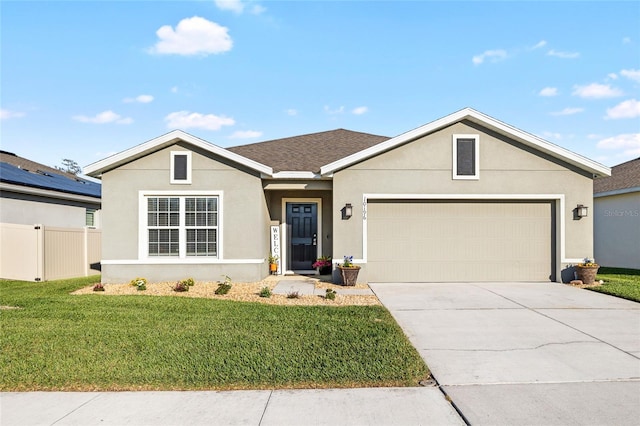 ranch-style house with fence, a front lawn, a garage, stucco siding, and concrete driveway