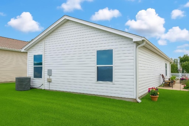 3533 Roanoke St, The Villages, FL 32162 - view of home's exterior with a patio, fence, central AC, and a lawn