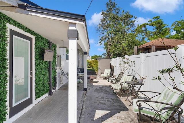 705 28th St N, Saint Petersburg, FL 33713 - view of patio / terrace featuring a fire pit and fence