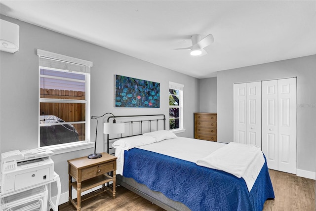 705 28th St N, Saint Petersburg, FL 33713 - bedroom featuring baseboards, a closet, ceiling fan, and wood finished floors