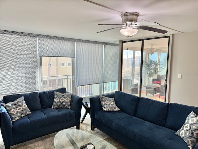 1390 Gulf Blvd Unit 104, Clearwater, FL 33767 - living room featuring a ceiling fan, healthy amount of natural light, and carpet flooring