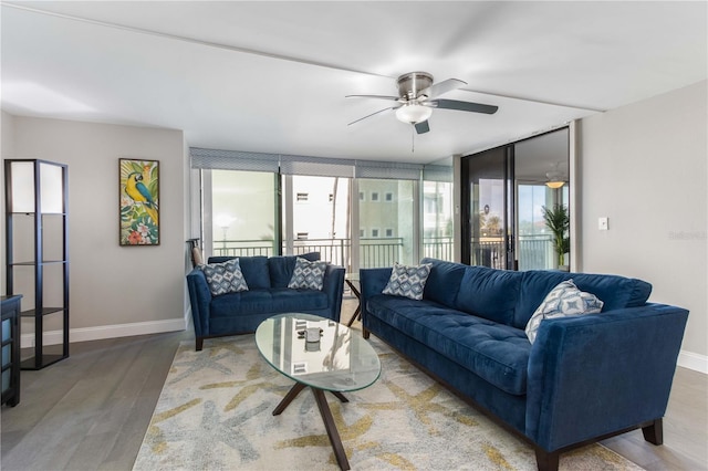 1390 Gulf Blvd Unit 104, Clearwater, FL 33767 - living area with ceiling fan and wood finished floors