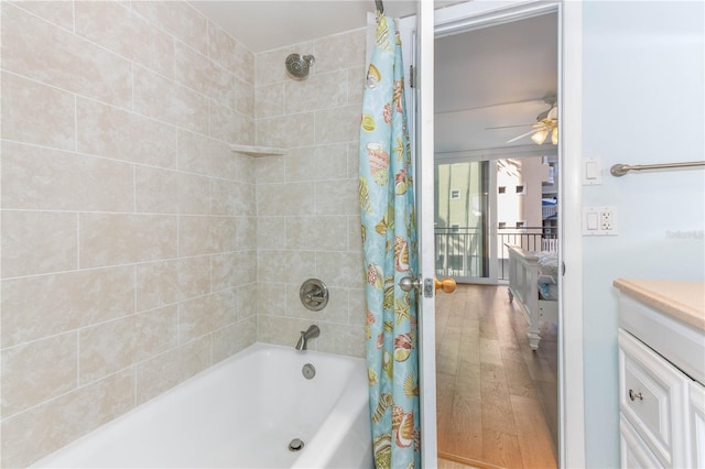 1390 Gulf Blvd Unit 104, Clearwater, FL 33767 - full bathroom featuring shower / bathtub combination with curtain, ceiling fan, vanity, and wood finished floors