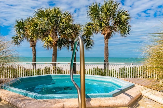 1390 Gulf Blvd Unit 104, Clearwater, FL 33767 - view of swimming pool featuring an in-ground hot tub and view of water and beach