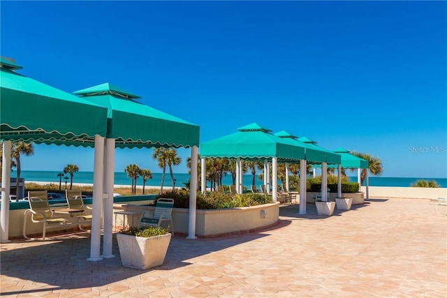 1390 Gulf Blvd Unit 104, Clearwater, FL 33767 - view of patio / terrace with a gazebo and a water view