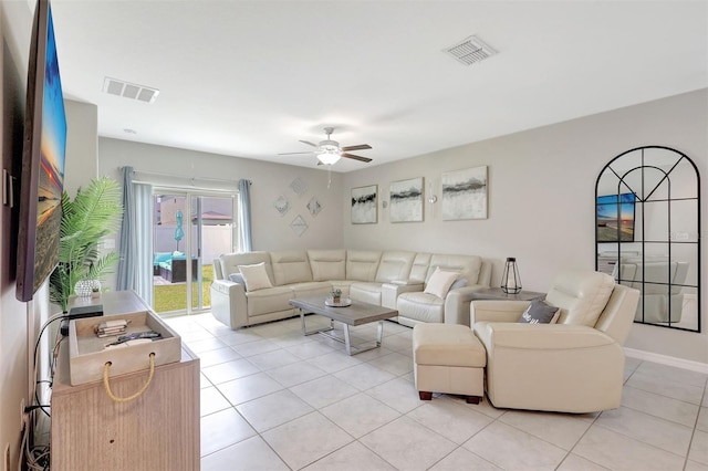 living room featuring light tile patterned floors, a ceiling fan, and visible vents