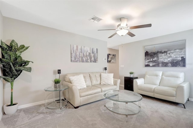 carpeted living area with visible vents, baseboards, and a ceiling fan