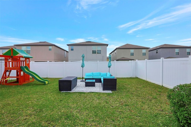 view of play area featuring a patio area, a yard, a fenced backyard, and an outdoor hangout area