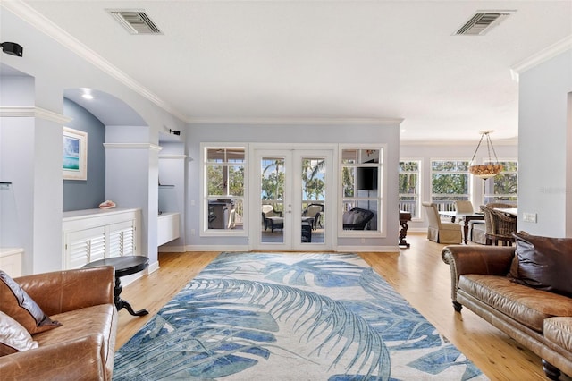 450 Bayshore Dr, Terra Ceia, FL 34250 - living area with visible vents, crown molding, and light wood finished floors