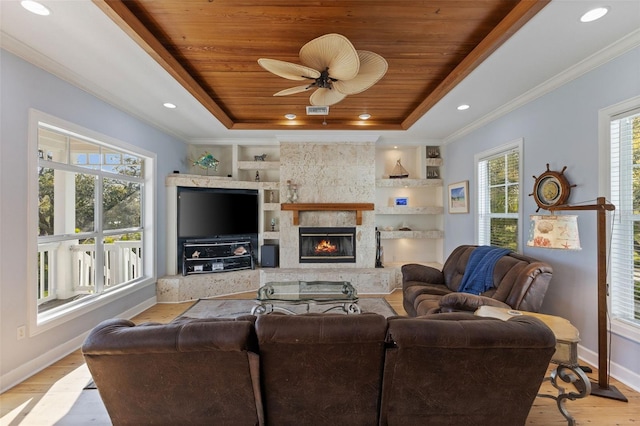 450 Bayshore Dr, Terra Ceia, FL 34250 - living area with a tray ceiling, crown molding, wood ceiling, built in shelves, and baseboards