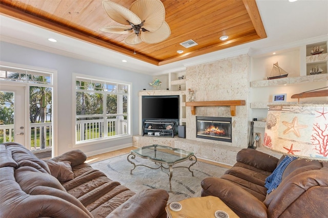 450 Bayshore Dr, Terra Ceia, FL 34250 - living area with crown molding, wooden ceiling, built in shelves, a raised ceiling, and visible vents