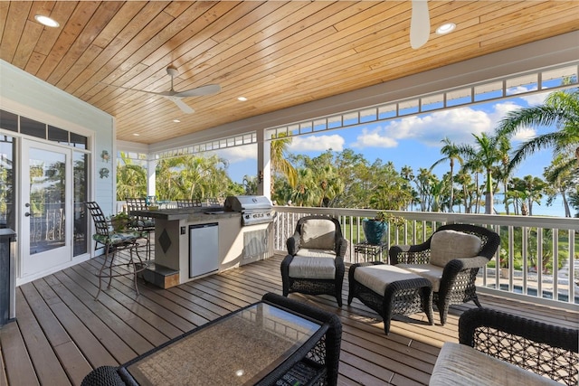 450 Bayshore Dr, Terra Ceia, FL 34250 - wooden terrace featuring an outdoor hangout area, area for grilling, and a ceiling fan